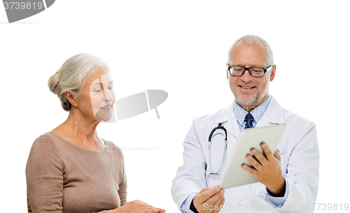 Image of smiling senior woman and doctor with tablet pc