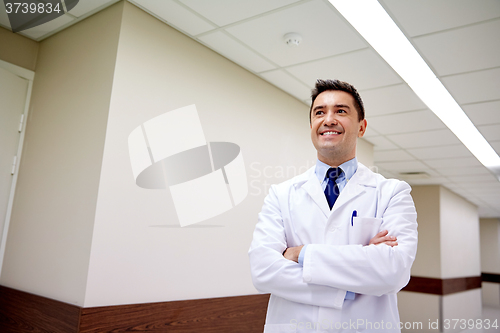 Image of smiling doctor at hospital corridor