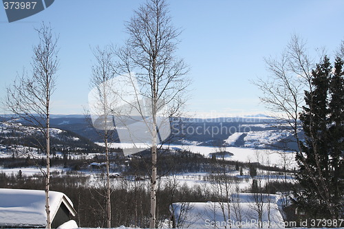 Image of Cabins and winter landscape