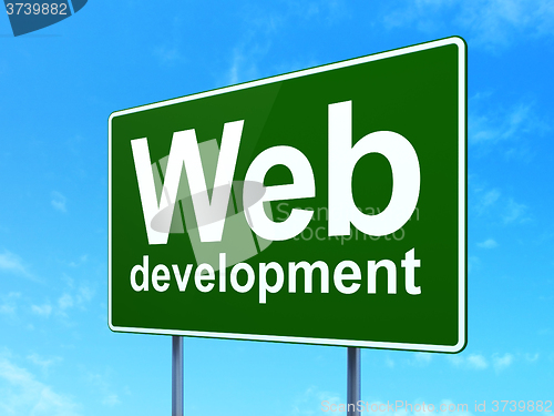 Image of Web development concept: Web Development on road sign background