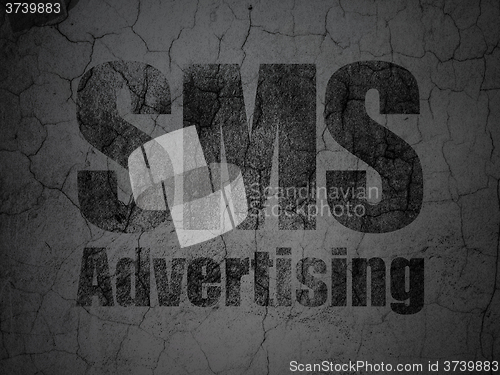 Image of Marketing concept: SMS Advertising on grunge wall background