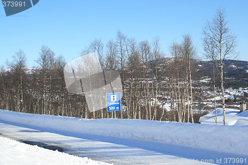 Image of Winter road with tourist information sign