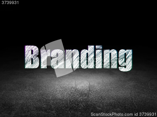 Image of Marketing concept: Branding in grunge dark room