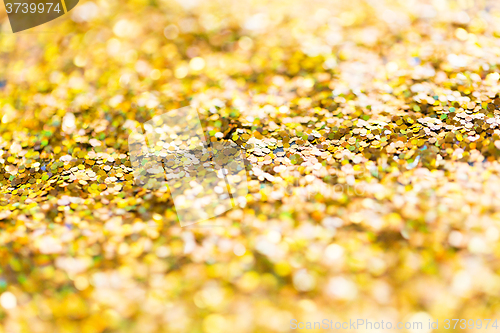 Image of golden glitter or yellow sequins background