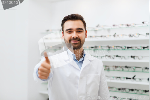 Image of man with glasses and thumbs up at optics store