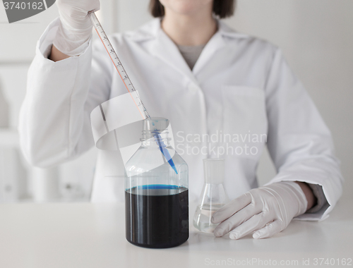 Image of close up of scientist making test in lab