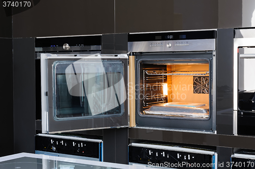 Image of Modern oven with door open