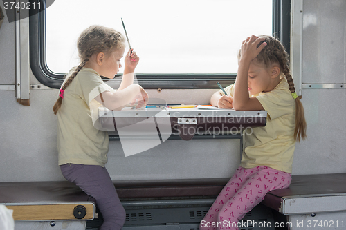 Image of Two girls painted for the side table in the second-class train carriage