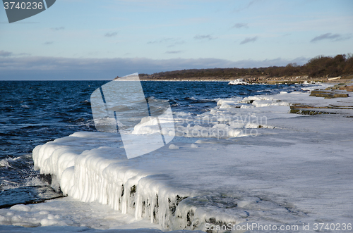 Image of Ice covered flat rock coast