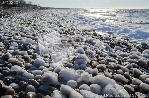 Image of Coast with ice covered stones