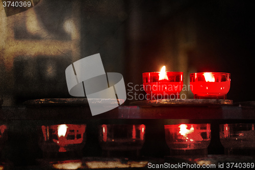 Image of Candle burning in church - Vintage dirty look