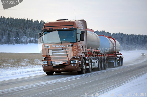 Image of Bronze Scania Tank Truck on Winter Road