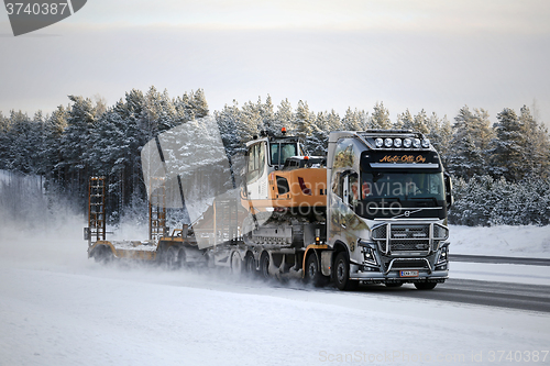 Image of Volvo FH16 Hauls Excavator on Motorway