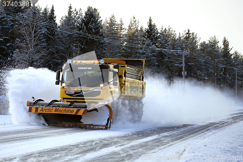 Image of Volvo FM Truck and Snow Plow Clears Winter Road