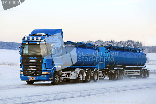 Image of Blue Scania R500 Tank Truck on the Road in Winter Weather