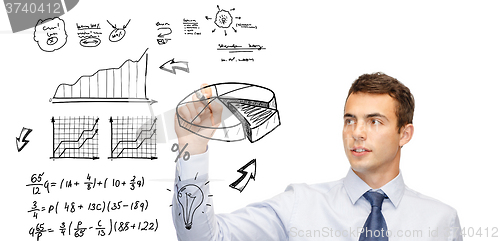 Image of buisnessman drawing plan on virtual screen