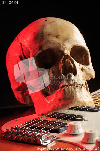 Image of Still life with skull and electric guitar