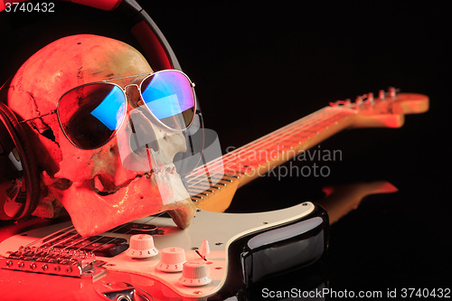 Image of Still life with skull and electric guitar