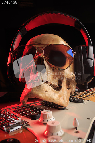 Image of Still life with skull and electric guitar