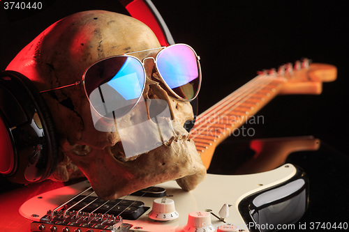 Image of Still life with skull and electric guitar