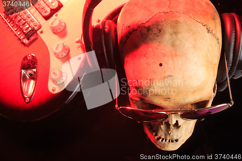 Image of Still life with skull and electric guitar