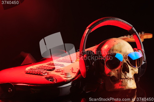 Image of Still life with skull and electric guitar