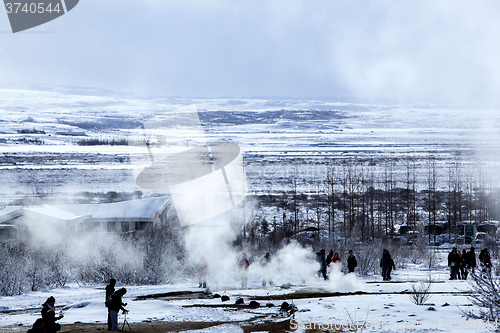 Image of Tourists at the famous geyser Strokkur, Iceland