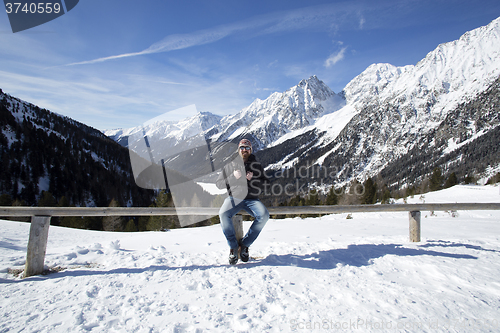 Image of Young man enjoys winter landscape