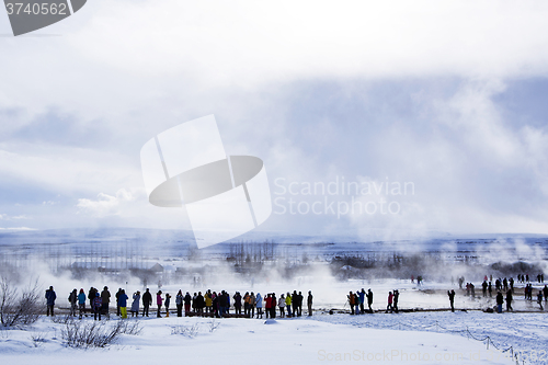 Image of Tourists at the famous geyser Strokkur, Iceland