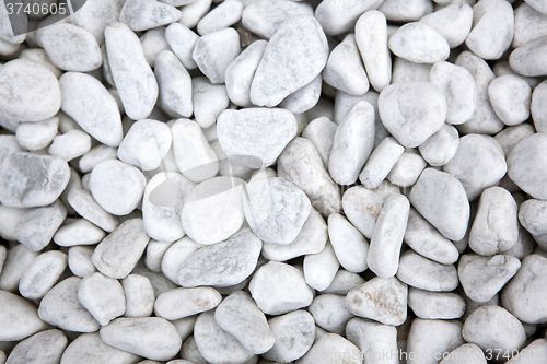Image of White stones at a grave as a background
