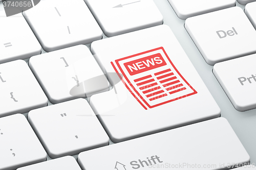 Image of News concept: Newspaper on computer keyboard background