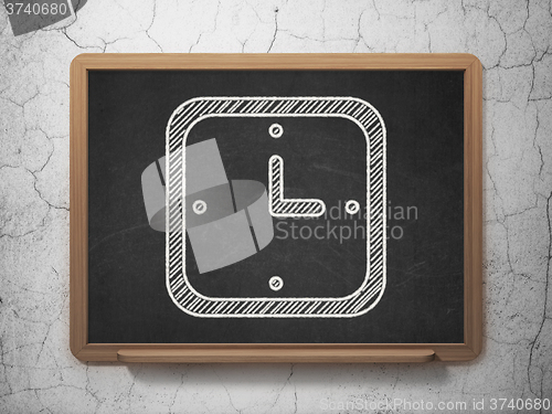Image of Time concept: Watch on chalkboard background