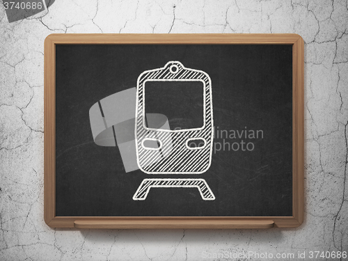 Image of Vacation concept: Train on chalkboard background