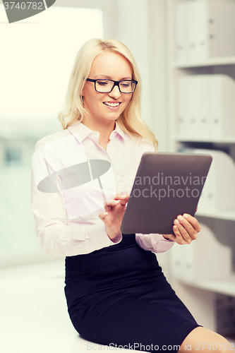 Image of smiling businesswoman or student with tablet pc