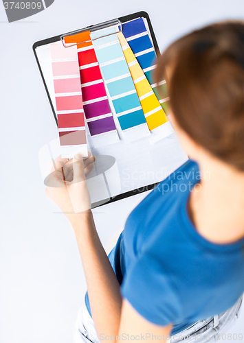 Image of woman working with color samples for selection