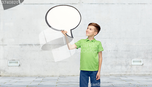 Image of happy boy holding blank white text bubble banner