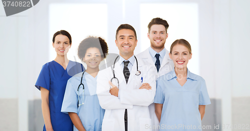 Image of group of happy doctors at hospital