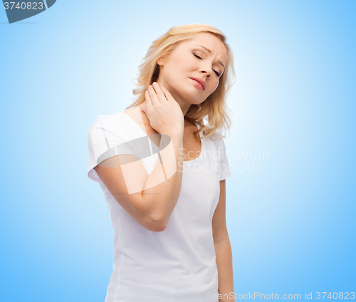 Image of unhappy woman suffering from neck pain