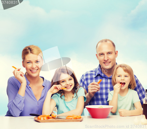 Image of happy family with two kids eating at home