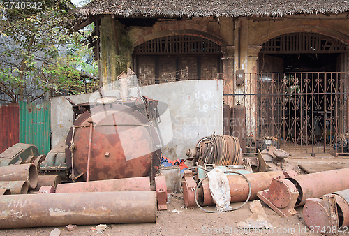 Image of Rusty machine parts on the street in Myanmar