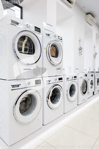 Image of washing mashines in appliance store