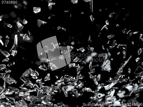 Image of Pieces of splitted glass on black shallow dof