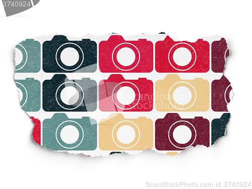 Image of Travel concept: Photo Camera icons on Torn Paper background