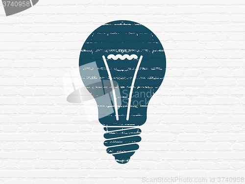 Image of Finance concept: Light Bulb on wall background