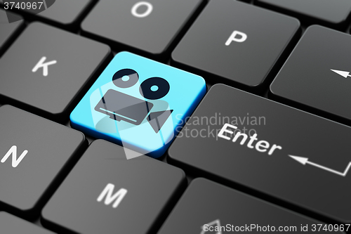 Image of Travel concept: Camera on computer keyboard background