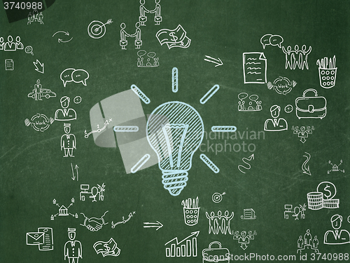 Image of Business concept: Light Bulb on School Board background