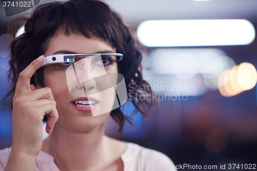 Image of woman using virtual reality gadget computer glasses