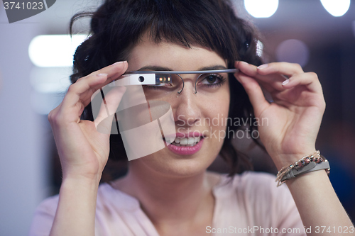 Image of woman using virtual reality gadget computer glasses