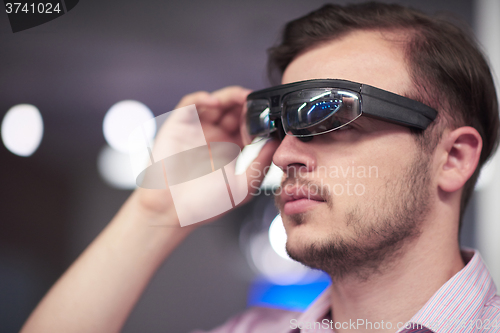 Image of man using virtual reality gadget computer glasses