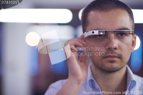 Image of man using virtual reality gadget computer glasses